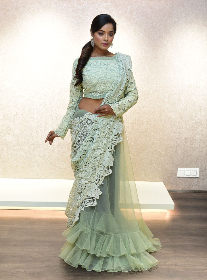 Light green ruffled bottom designer saree